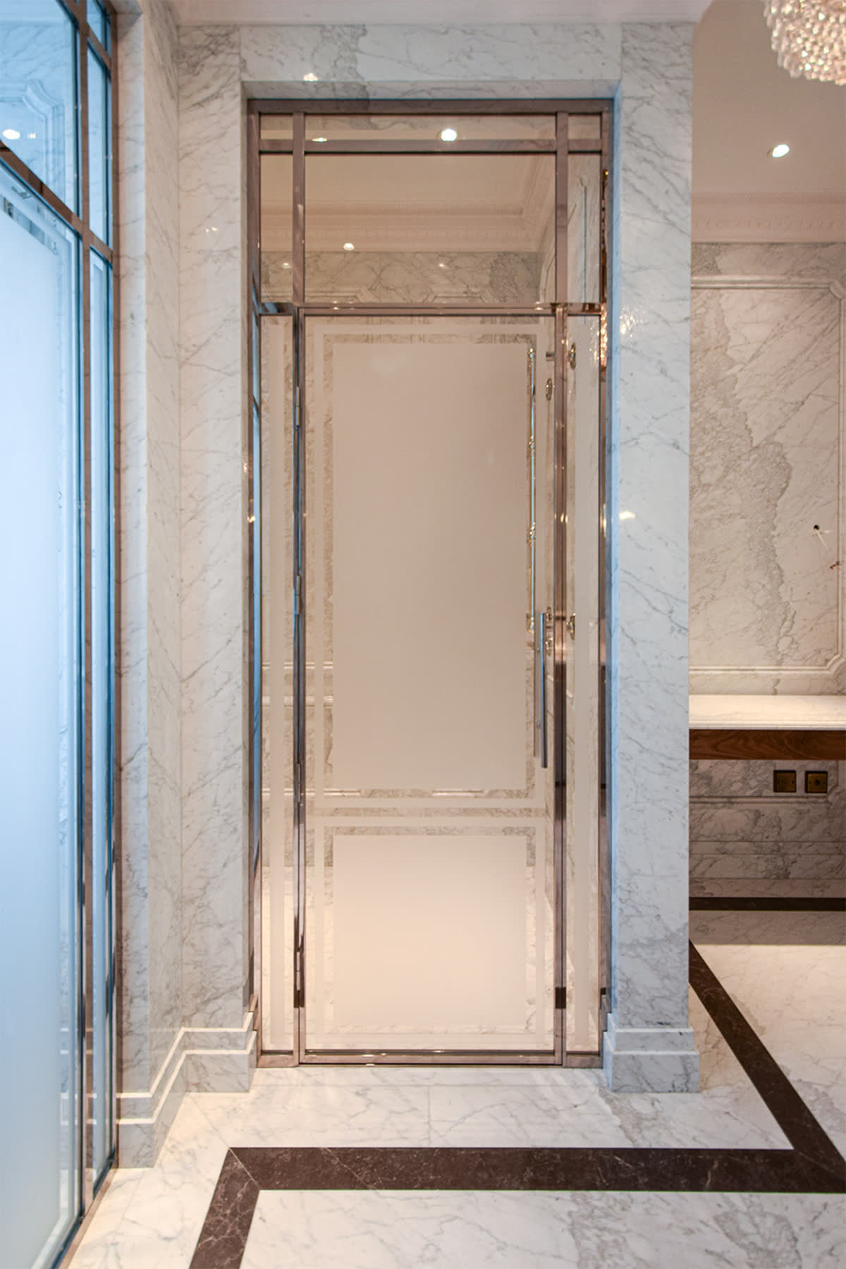 bespoke shower door in a nickel frame with partially sandblasted glass