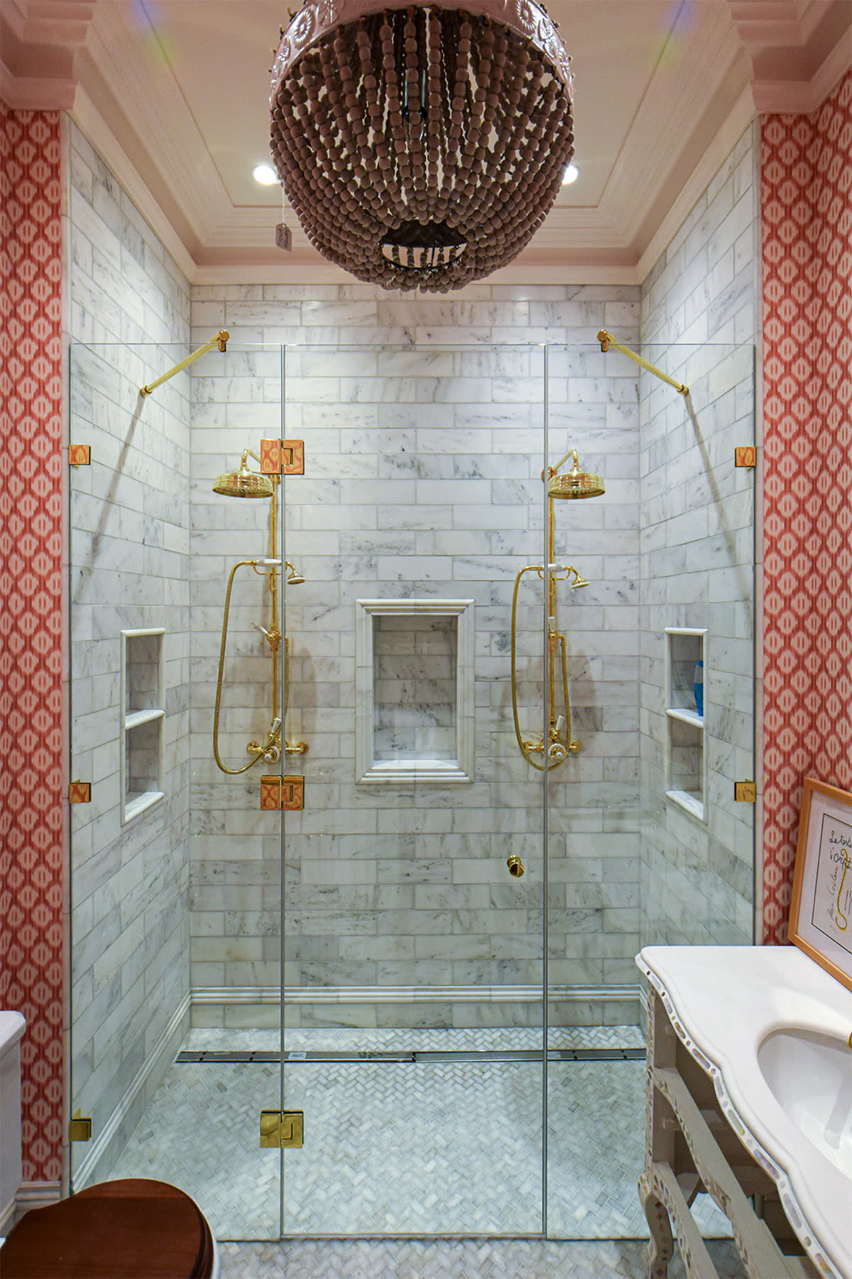 custom made frameless inline shower door with two screens and brass fixtures