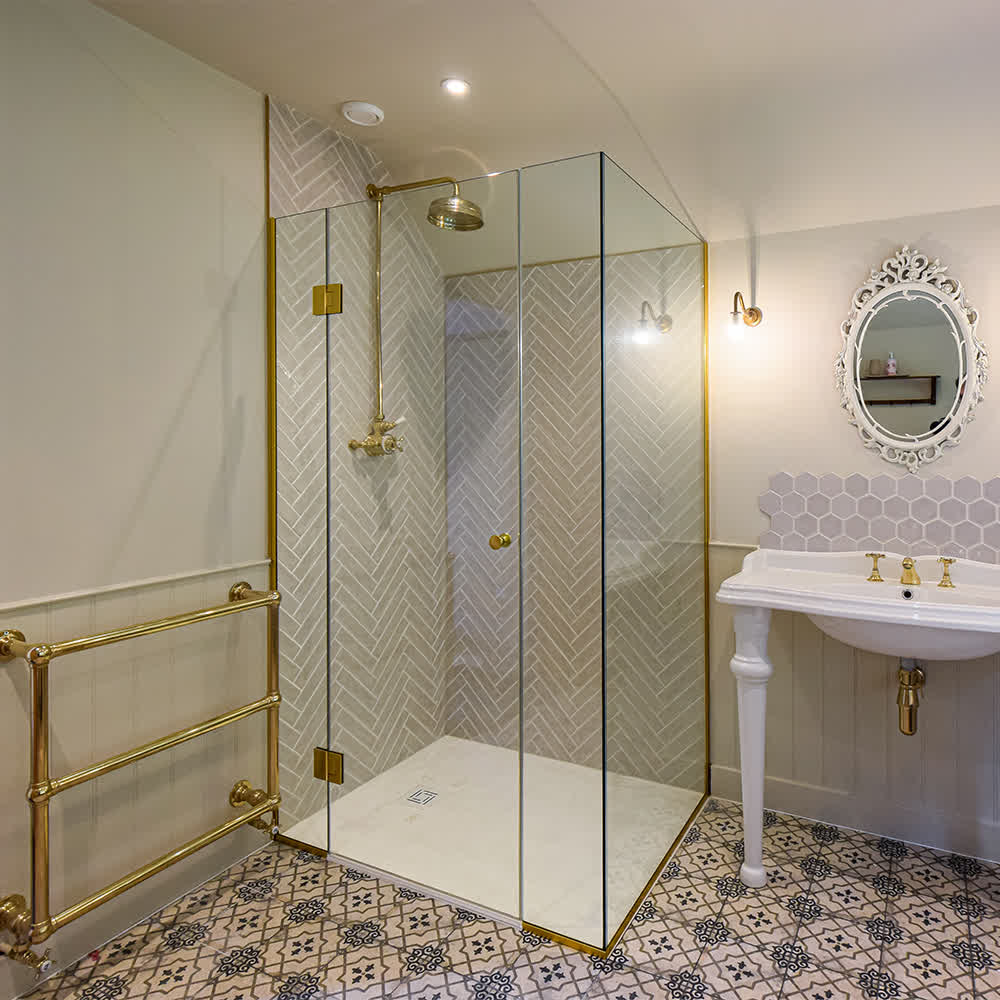 shower enclosure with brass profiles