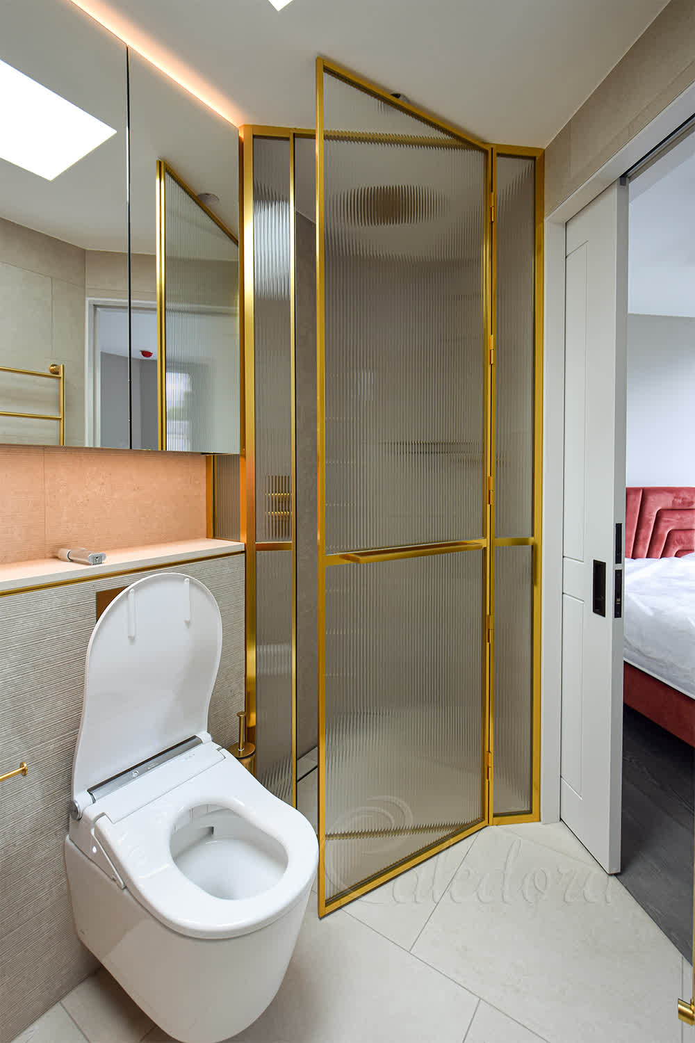 brass shower enclosure with reeded glass