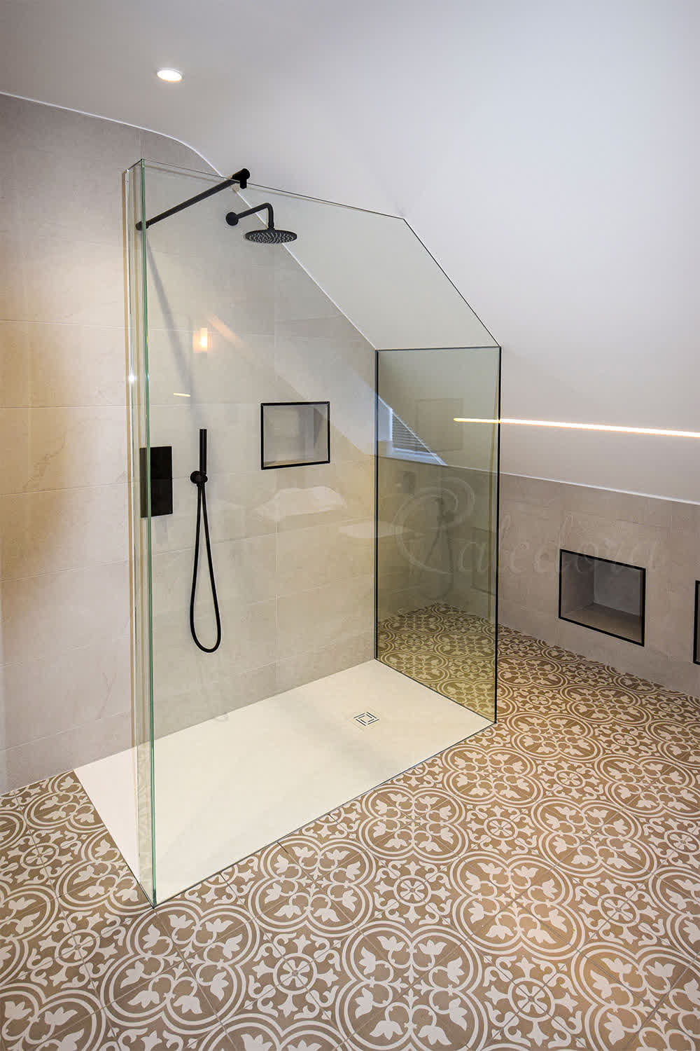 Walk-in angled L-shape shower screen with UV bonded panels and wall recessed fixing