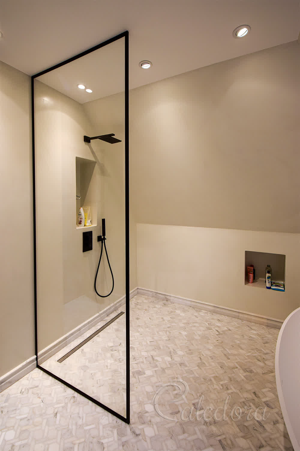 Black frame walk-in shower screen with ultra-clear glass in London bathroom with marble floor