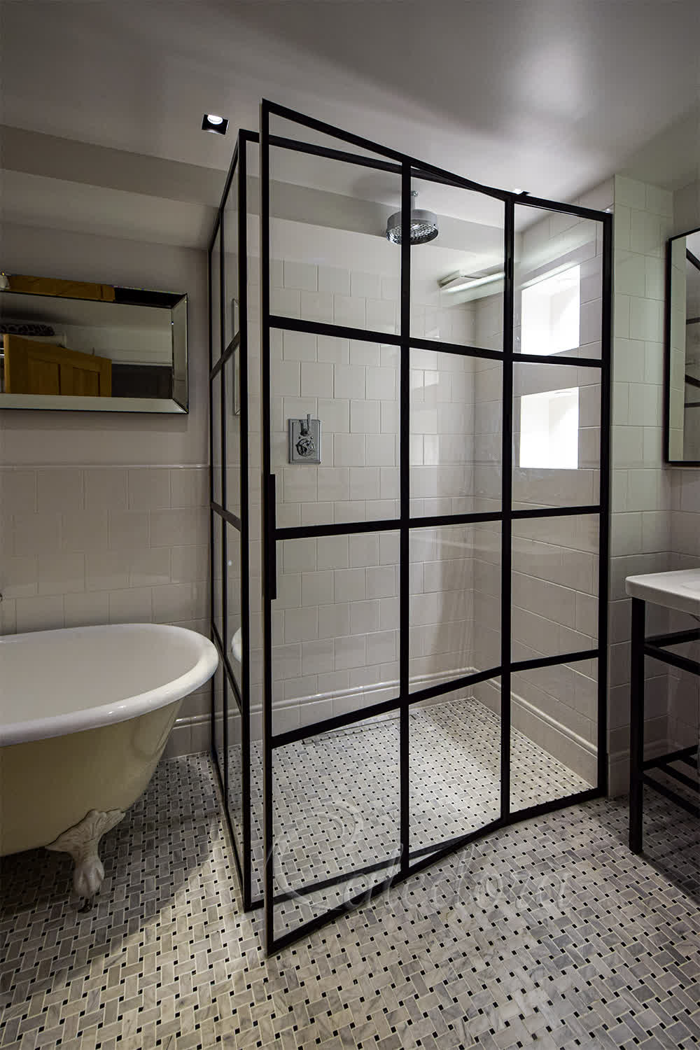 Toughened clear glass enclosure with hidden hinges and uniform framing