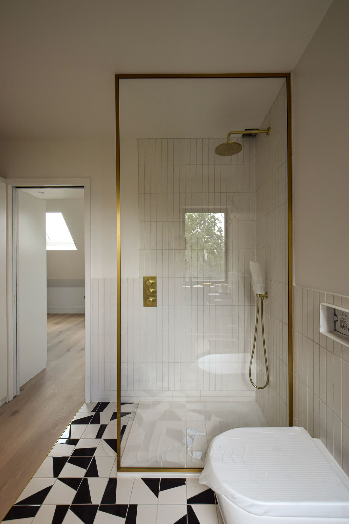 Brushed Brass framed shower screen with ultra clear glass in London bathroom