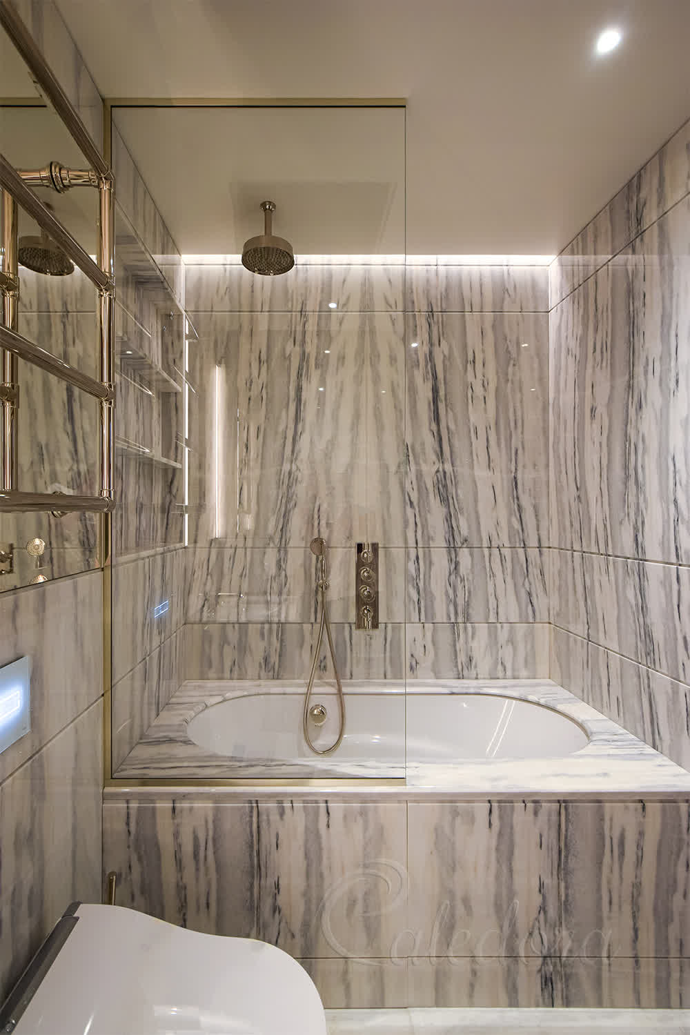 Full height fixed bath shower panel with polished nickel U-channels installed over half of the bath