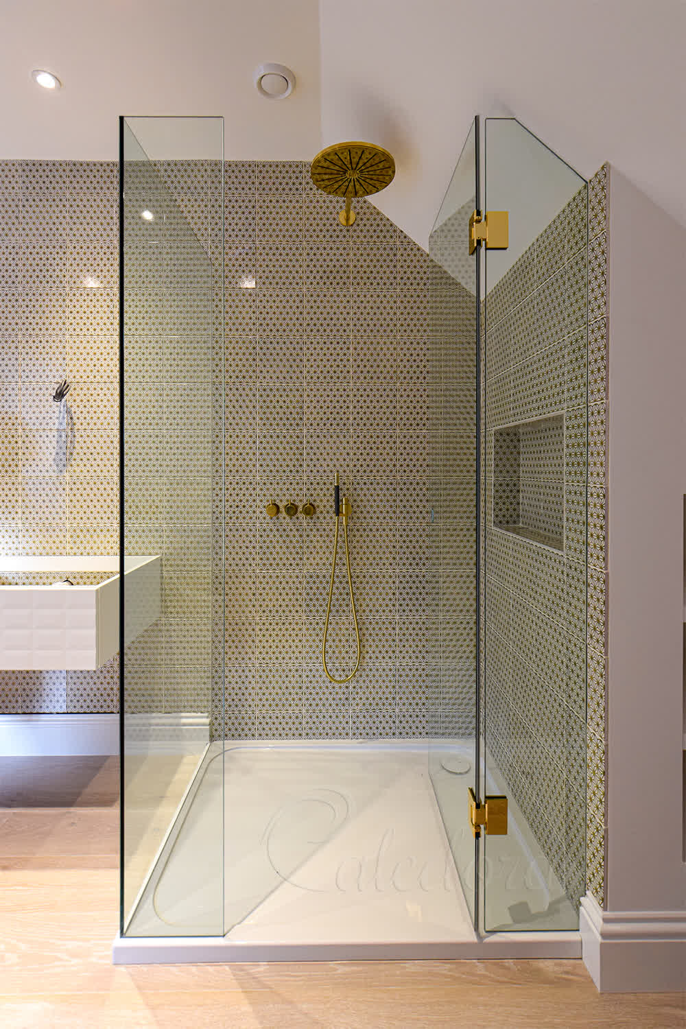 UV-bonded glass panels in corner loft shower with no metal bar