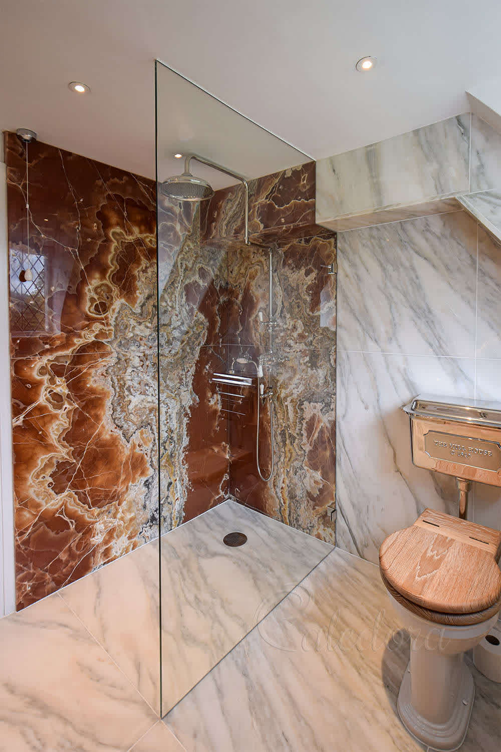 Full-height walk-in shower screen with polished chrome brackets and ultra clear glass
