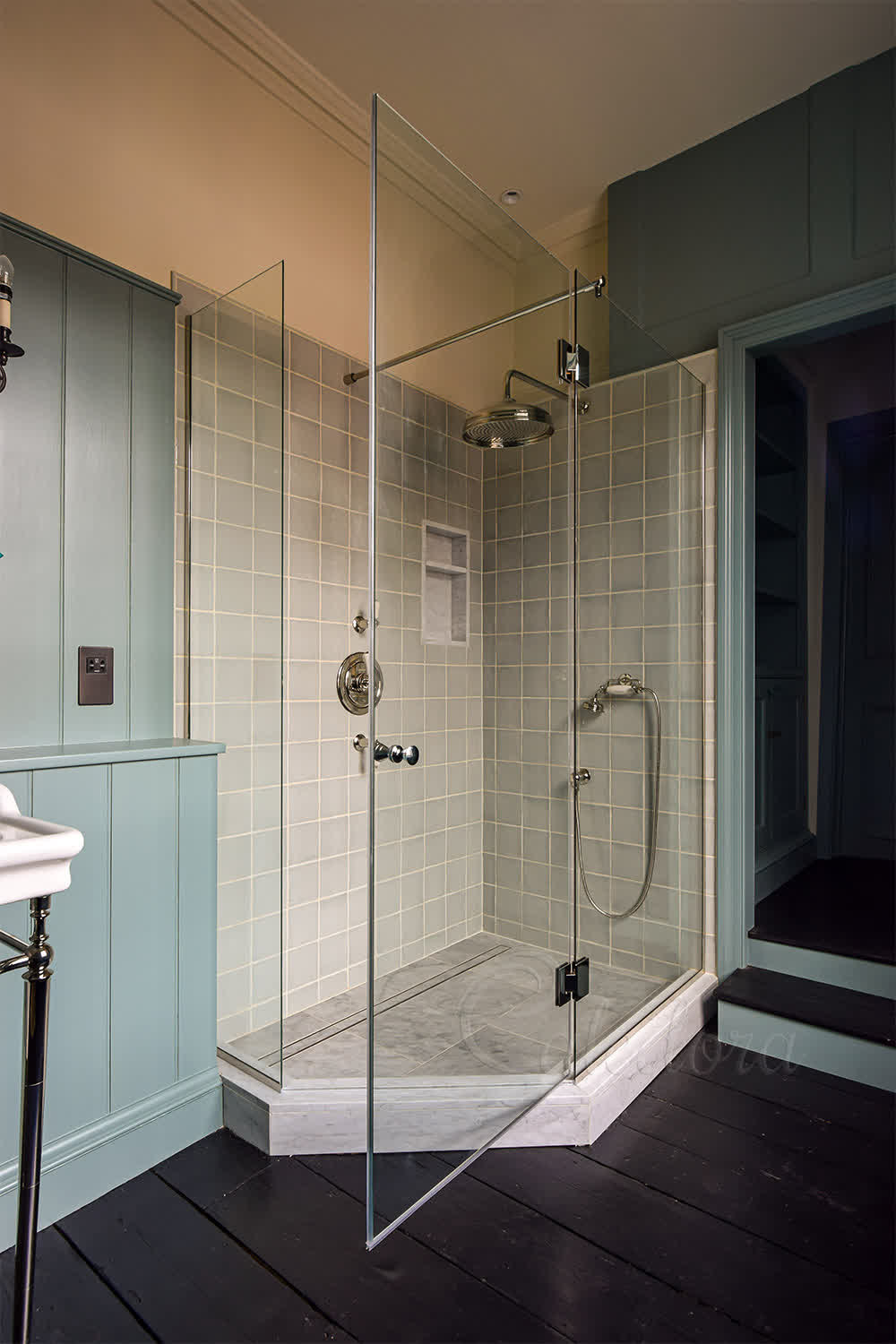 Pentagon shower enclosure with nickel hinges and timber wall panels in Basingstoke