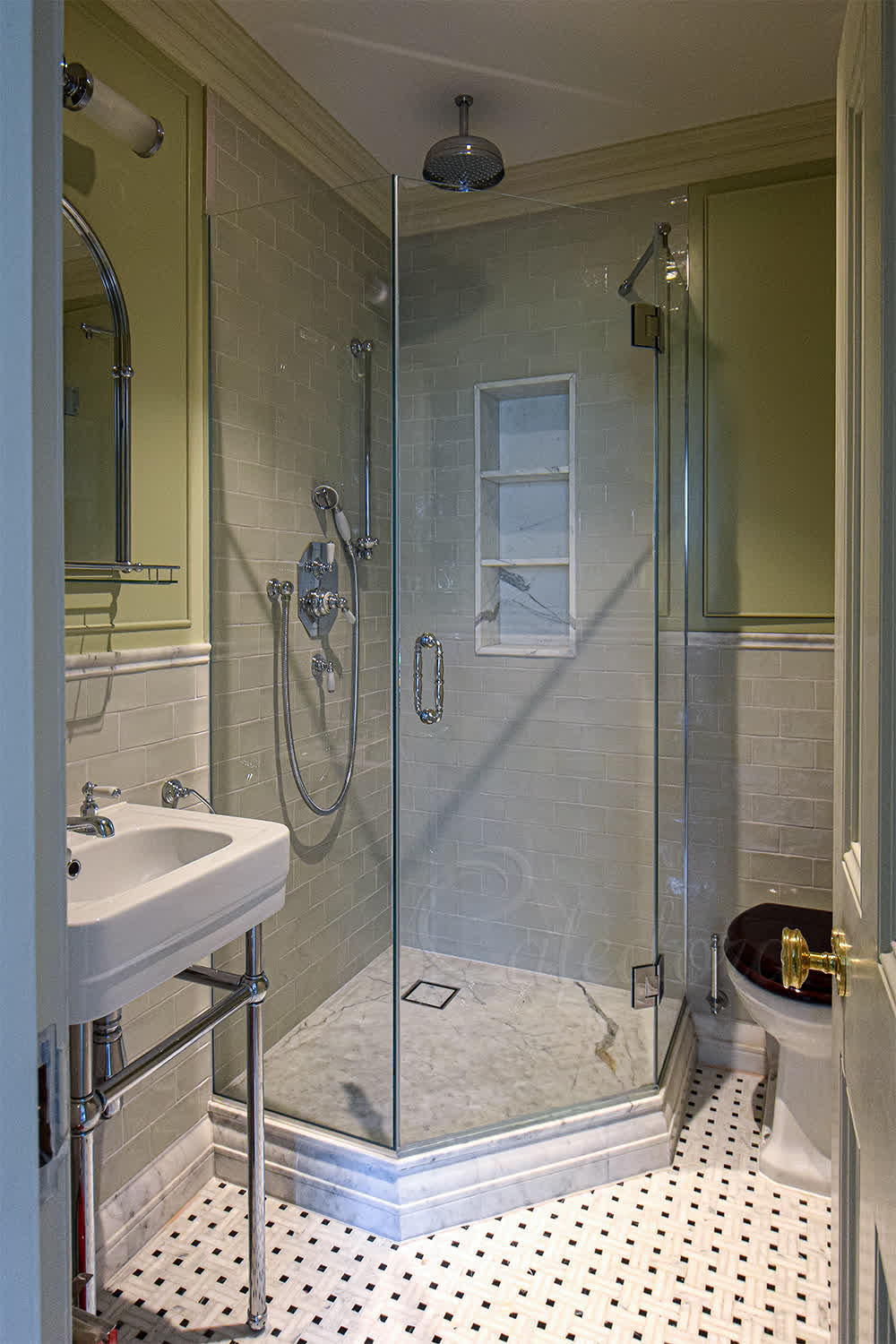 Pentagonal shower enclosure with chrome fixtures in a small Farnham bathroom