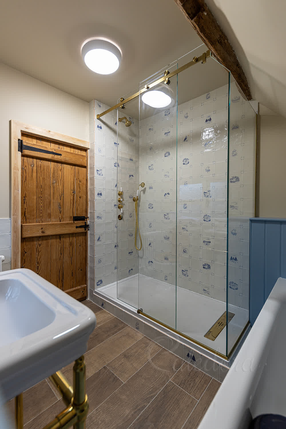Sliding glass shower door with track system