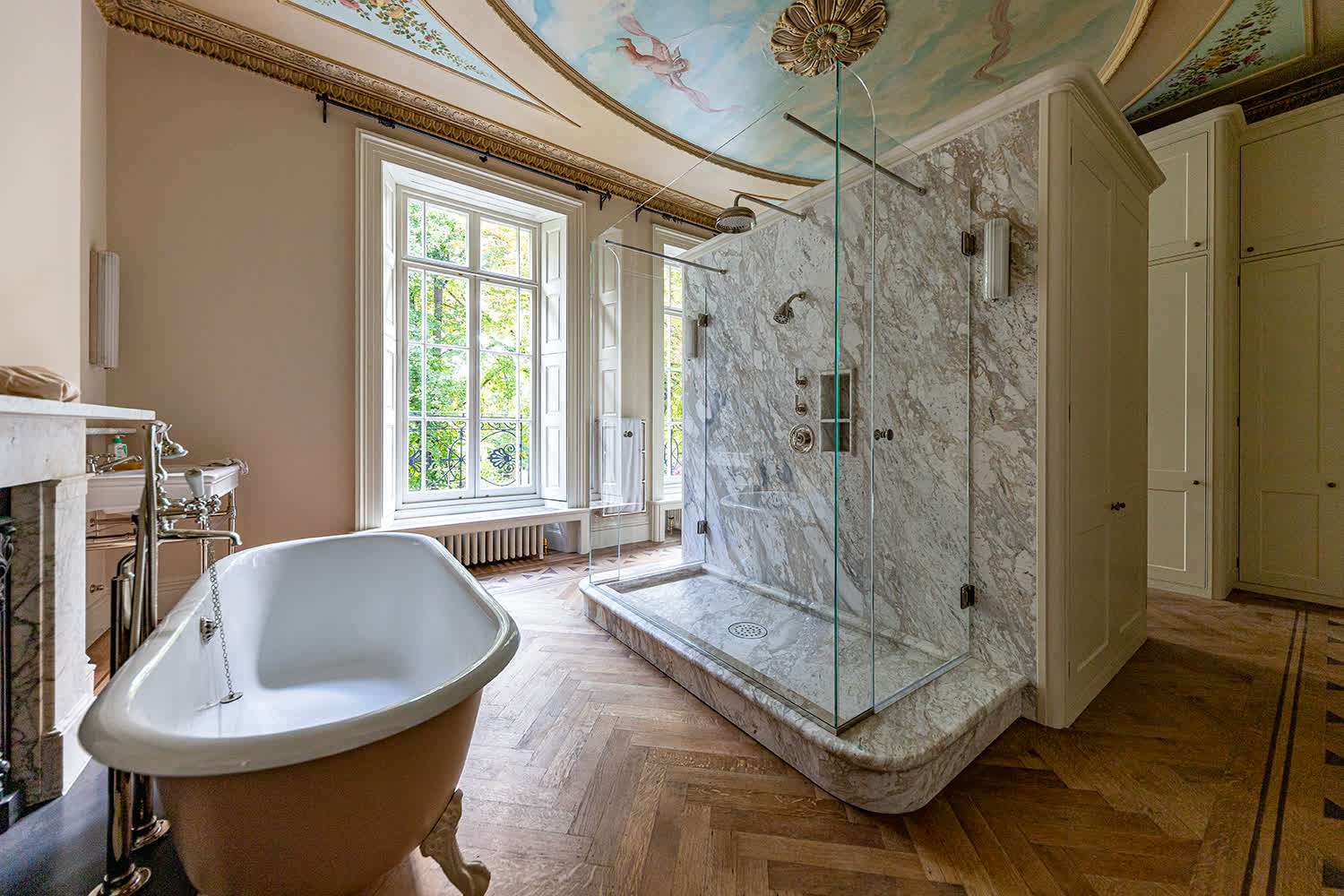 frameless glass shower enclosure in a large bathroom