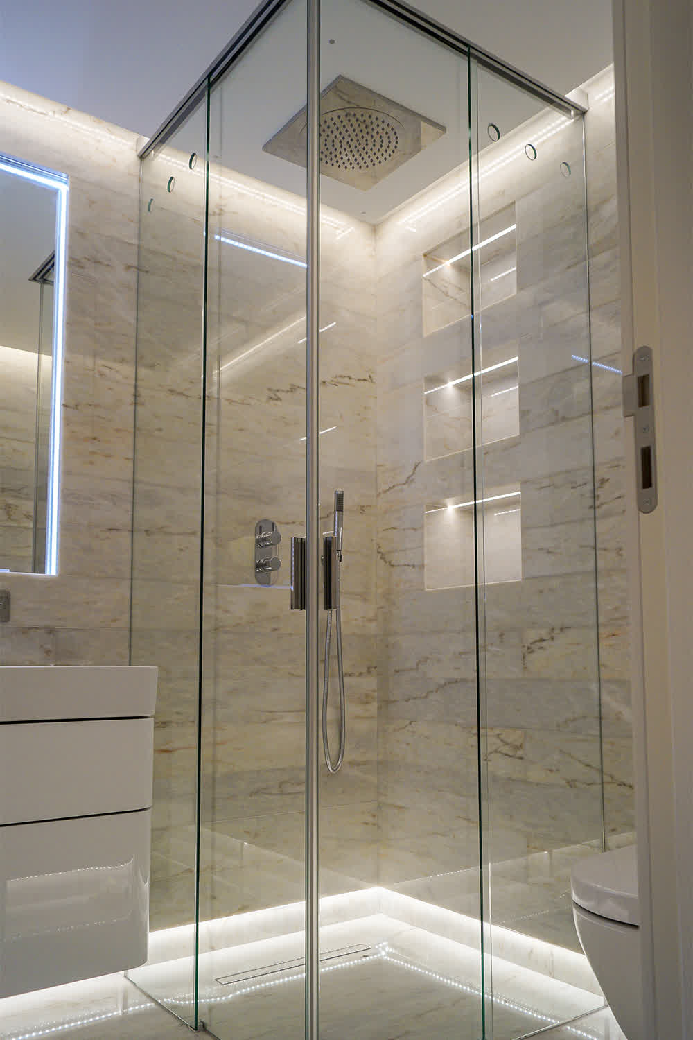 shower with sliding track recessed into ceiling