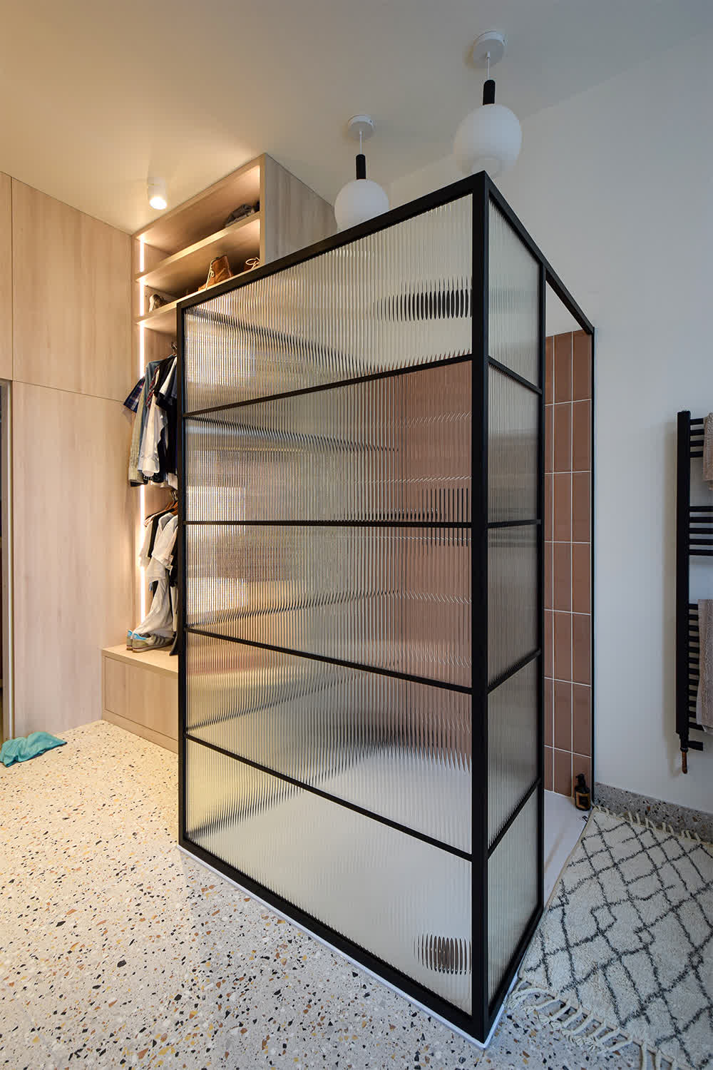 three-sided industrial-style shower screen with reeded glass