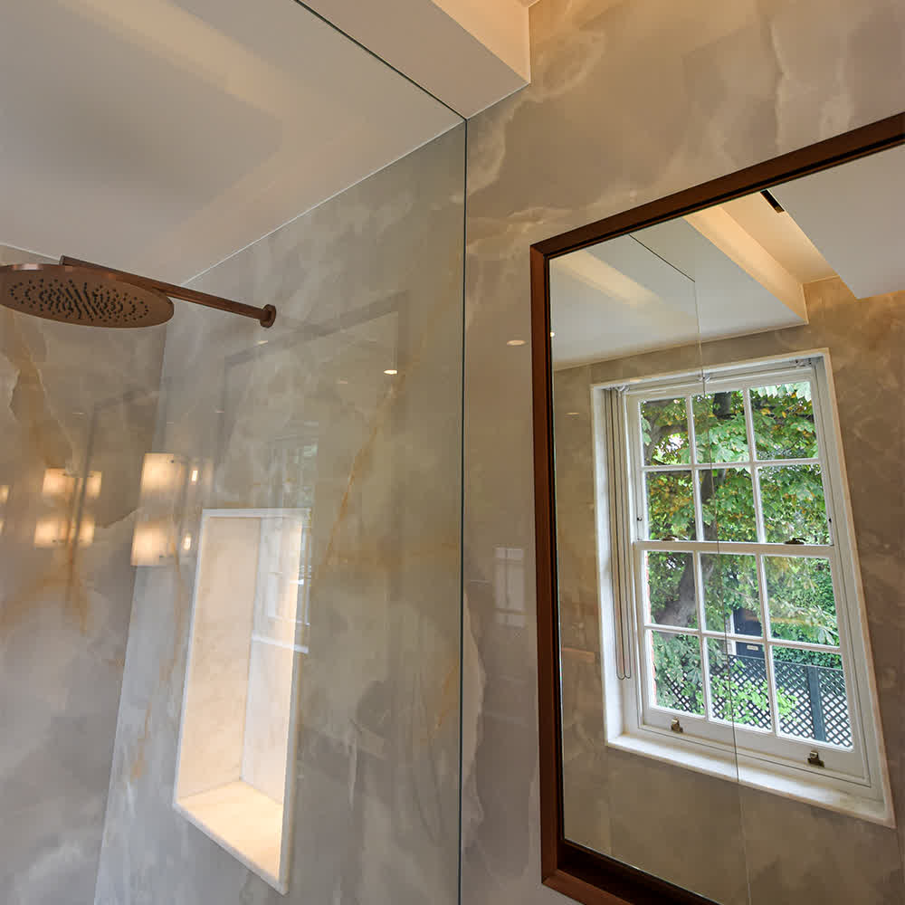 a shower panel recessed into the wall