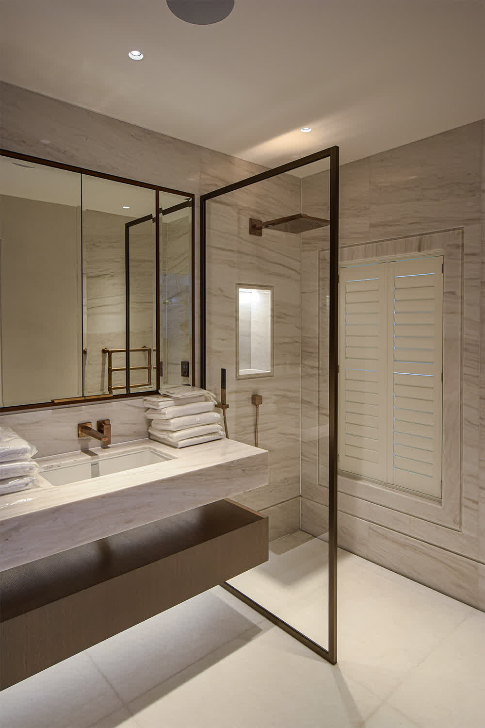 shower screen with the frame in a bronze finish